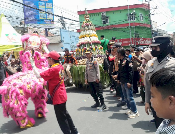 Polsek Krian Amankan Kirab Budaya Sedekah Bumi Perayaan Kongco Kong Tek Cun Ong